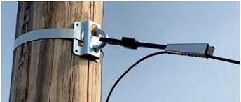 Bail wire clamp uses in energy infrastructure